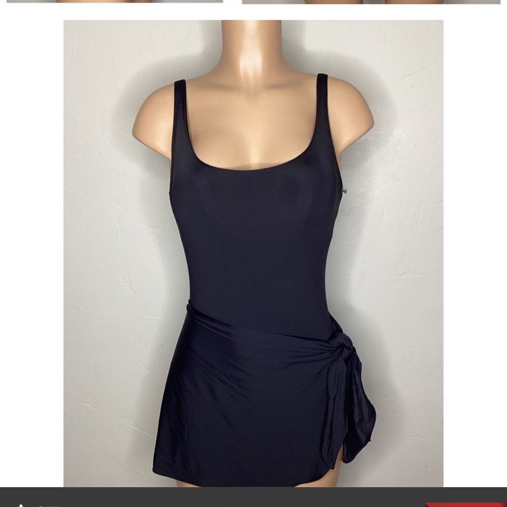 New. Coco Reef black skirted one piece. Size 14. Retails $152
